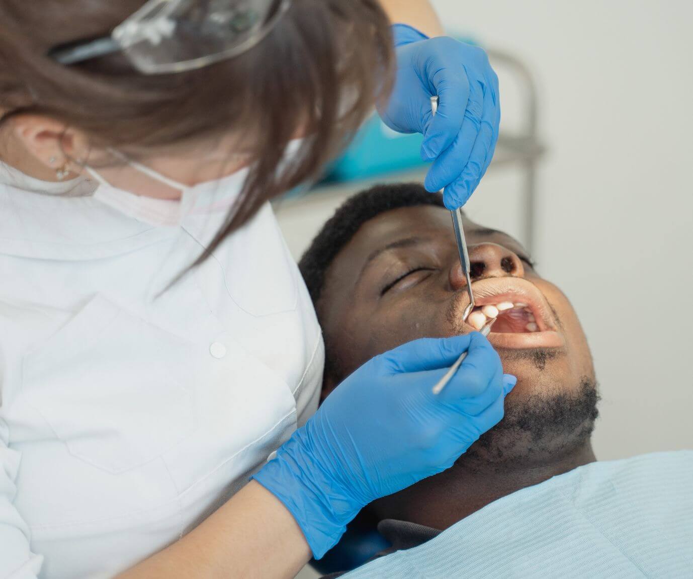 Man getting dental work done during an emergency dental appointment